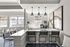 Modern and bright communal space featuring a stylish breakfast bar with sleek seating, large windows for natural light, and elegant wall art.