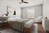 Elegant bedroom with cozy wooden bed, modern decor, and ample natural light from large window.