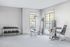 Bright and spacious home gym with modern fitness equipment and natural light streaming through large windows. Ideal for a healthy lifestyle.