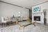 Elegant living room with a cozy fireplace, modern furniture, and stylish decor, perfect for relaxation and entertaining.