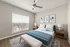 Elegant bedroom featuring a cozy double bed with plush pillows, stylish wall art, and ample natural light from a large window, perfect for a serene retreat.