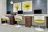Modern workspace featuring three stylish computer stations with sleek white and green chairs, vibrant floral artwork, and contemporary decor.