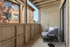 Charming balcony retreat featuring a modern chair with a cozy pillow, perfect for relaxation and enjoying outdoor views.