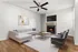 Elegant living room with modern decor, featuring a cozy fireplace, sleek ceiling fan, and comfortable seating.