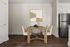 Inviting dining area with a rustic wooden table, elegant seating for four, and modern art piece on the wall, complemented by warm wood flooring.