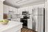 Contemporary kitchen with sleek stainless steel appliances, white cabinetry, and elegant countertops perfect for modern living.
