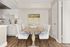 Elegant dining area with stylish tufted chairs, rustic wooden table, and modern kitchen backdrop; perfect for entertaining.