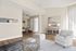 Bright and elegant living space featuring chic decor, a cozy armchair, stylish coffee table, and inviting dining area, perfect for modern living.