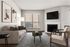 Elegant living room with a cozy fireplace, modern wall-mounted TV, stylish artwork, and a comfortable beige sofa overlooking a scenic window view.