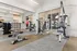 Modern fitness center with state-of-the-art gym equipment, stylish design, and ample natural lighting.