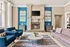Elegant living room with a cozy fireplace, modern decor, and luxurious blue accents, perfect for relaxation and entertainment.