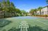 Inviting outdoor basketball court surrounded by lush greenery and modern apartments, perfect for sports enthusiasts and active lifestyles.
