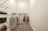 Luxurious walk-in closet with ample hanging space and organized shelving, perfect for a stylish wardrobe.