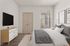 Modern bedroom featuring elegant decor, a comfortable bed with plush pillows, and a chic wall-mounted TV for relaxation.