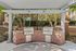 Inviting outdoor barbecue area with stainless steel grills and elegant brickwork, perfect for entertaining.