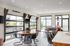 Modern apartment interior featuring an open-concept living area with large windows, stylish furniture, and a natural light-filled space perfect for relaxation.
