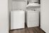 Modern laundry area featuring sleek washer and dryer with minimalist design on elegant wood flooring.