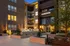Welcoming evening view of Legacy North apartments with illuminated signage, highlighting modern design and inviting leasing center entrance.