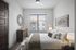 Modern and cozy bedroom with stylish decor, featuring a large window with natural light, elegant wall art, and a comfortable bed with plush pillows.