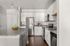Sleek modern kitchen with granite countertops, stainless steel appliances, and chic pendant lighting.