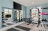 Modern home gym featuring state-of-the-art equipment, mirrors, and large windows for natural light.