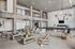 Luxurious open-concept living area featuring modern furnishings, elegant lighting, and a stylish double-height ceiling.