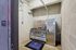 Modern indoor dog wash station featuring stainless steel tub and colorful wall graphics, perfect for pet-friendly living.