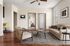 Chic apartment living room featuring elegant decor, cozy seating area, and warm wooden flooring, creating a welcoming ambiance.