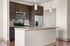 Modern kitchen with sleek granite countertops, stainless steel appliances, and elegant pendant lighting.
