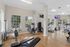 Bright and modern fitness center with state-of-the-art gym equipment and large windows offering a scenic view.