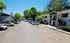Inviting apartment complex with sunny, tree-lined streets and convenient parking.
