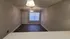 Inviting living space featuring elegant dark wood floors, modern ceiling fan, and ambient lighting, perfect for cozy gatherings.