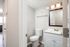 Modern bathroom with sleek fixtures, bright lighting, and elegant white cabinetry, offering a refreshing and contemporary feel.