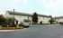 Charming apartment complex with landscaped gardens and ample parking, offering a serene residential experience.