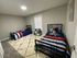 Inviting bedroom with two twin beds, modern decor, and a cozy ambiance perfect for relaxation.