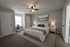 Inviting bedroom with plush bedding, modern decor, and serene lighting, creating a cozy and elegant atmosphere.