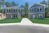 Charming suburban homes with modern exteriors, surrounded by lush green lawns and a scenic wooded backdrop.