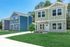 Charming modern homes with vibrant exteriors, inviting pathways, and lush green lawns in a serene neighborhood setting.