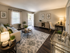 Bright and inviting living room featuring elegant decor, a cozy sofa, stylish coffee table, and abundant natural light creating a warm, welcoming atmosphere.