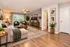 Elegantly designed living room featuring plush sectional sofa, modern decor, and large window with abundant natural light.