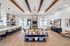 Elegant open-concept living room with modern chandelier, stylish decor, and spacious seating area perfect for entertaining.