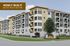 Modern apartment complex with stylish balconies and large windows, newly built and ready for April 2026 occupancy at Hideaway Heights.