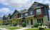 Charming modern townhomes in a vibrant suburban neighborhood, showcasing elegant design and cozy living spaces.