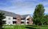 Inviting Silverstone Apartment Homes with charming brick facade and lush green lawns in a serene neighborhood.