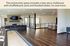 Bright and spacious community clubhouse featuring modern decor, a cozy fireplace, bar seating, and shuffleboard for entertainment.