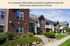 Charming Silverstone Apartment Homes in a serene westside neighborhood, featuring modern red brick buildings with lush greenery and inviting walkways.