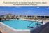 Luxurious outdoor pool area with lounge chairs and scenic views at Aspen Hill Apartment Homes in Verona.