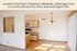Bright and inviting apartment kitchen with modern cabinets, open layout, and elegant chandelier in Madison's Westside community of Oakbridge Court.