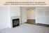 Inviting apartment interior with a cozy fireplace, spacious living and dining area, and elegant flooring.