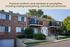 Charming brick apartment complex with private balconies, surrounded by lush greenery, offering underground parking and secure intercom access.